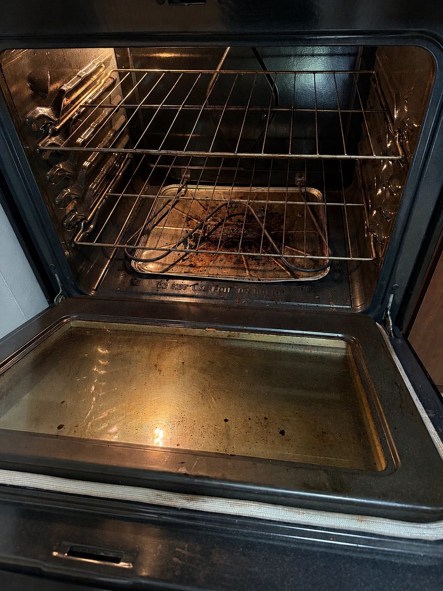 Oven interior before Ivybrook cleaning, with baked-on grease and debris