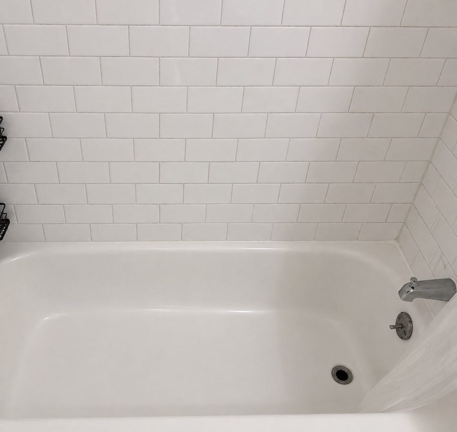 Same bathtub and tile after Ivybrook cleaning, bright and spotless